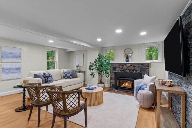 31 Brookside Dr, North Smithfield, RI 02896 - living room with light wood-style floors, a stone fireplace, plenty of natural light, and recessed lighting