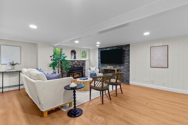 31 Brookside Dr, North Smithfield, RI 02896 - living area featuring a stone fireplace, wood finished floors, baseboard heating, recessed lighting, and baseboards