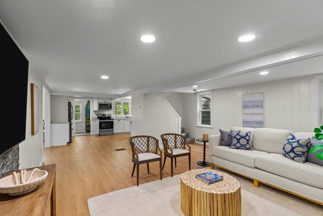 31 Brookside Dr, North Smithfield, RI 02896 - living room featuring stairs, light wood-style floors, recessed lighting, and ornamental molding