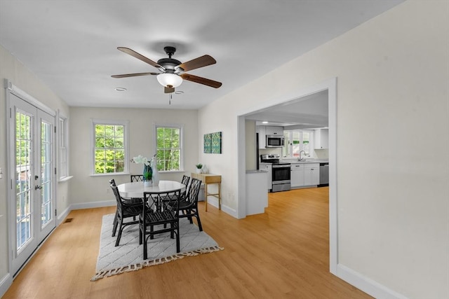 31 Brookside Dr, North Smithfield, RI 02896 - dining room with baseboards, light wood-style flooring, and french doors