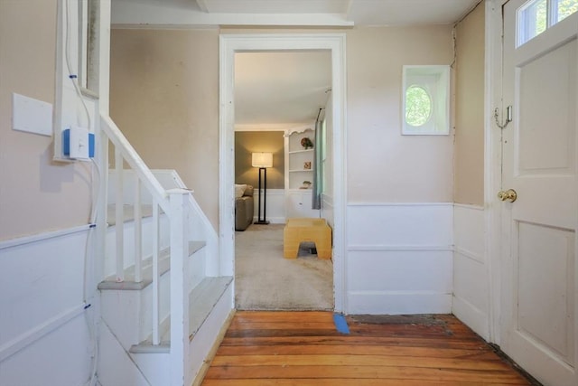 137 High St, Danvers, MA 01923 - entryway featuring stairway, light wood-type flooring, and a wainscoted wall