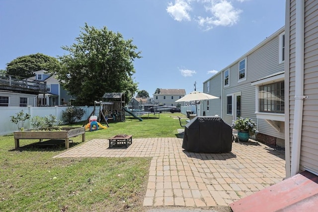 137 High St, Danvers, MA 01923 - view of patio / terrace featuring a fire pit, a playground, and grilling area
