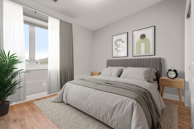 bedroom with light hardwood / wood-style flooring