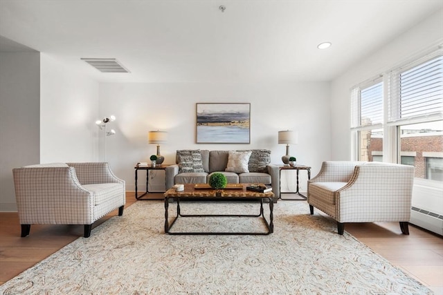 1 Davenport St Unit 11, Cambridge, MA 02140 - living area featuring wood finished floors, recessed lighting, baseboards, and baseboard heating