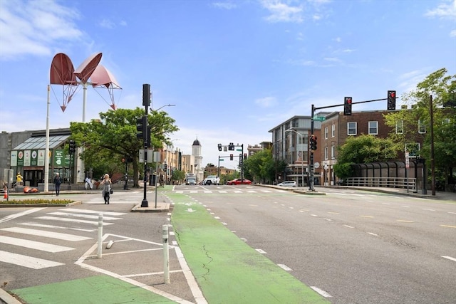 1 Davenport St Unit 11, Cambridge, MA 02140 - view of asphalt road with traffic lights, street lights, curbs, sidewalks, and traffic signs