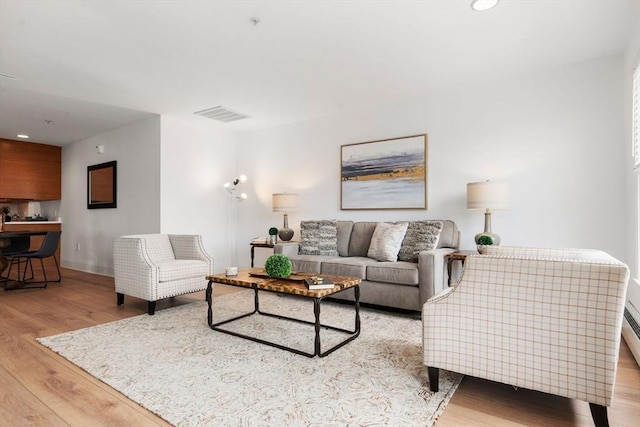 1 Davenport St Unit 11, Cambridge, MA 02140 - living area featuring light wood-style floors, baseboards, and recessed lighting