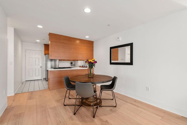1 Davenport St Unit 11, Cambridge, MA 02140 - dining area featuring light wood finished floors, baseboards, and recessed lighting