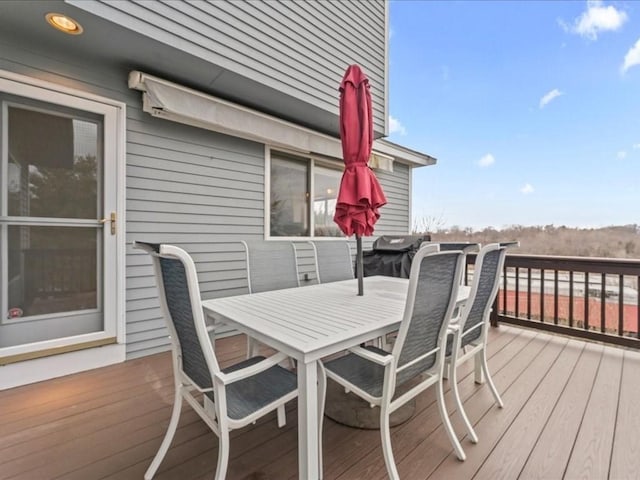 wooden deck with outdoor dining area