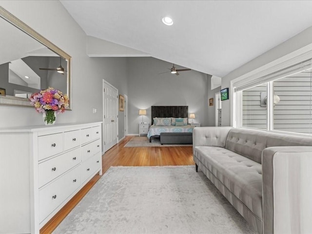 bedroom featuring lofted ceiling, recessed lighting, light wood finished floors, baseboards, and ceiling fan