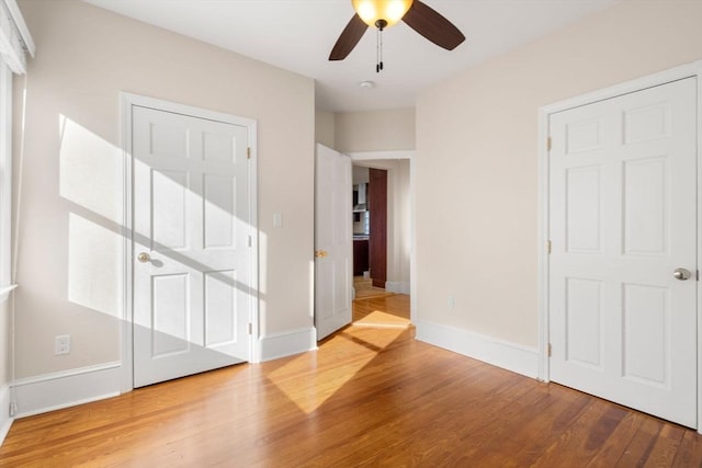 spare room featuring ceiling fan and hardwood / wood-style floors