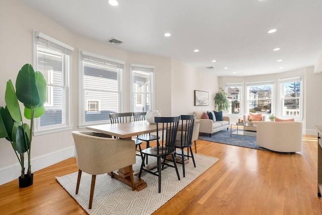 dining room with light hardwood / wood-style flooring