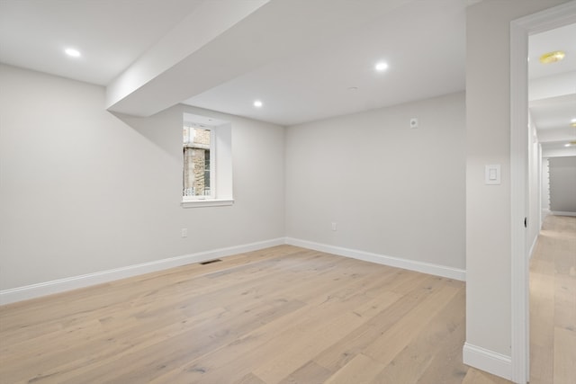 basement featuring light hardwood / wood-style floors