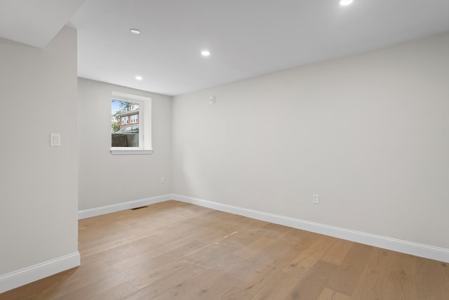 spare room with light hardwood / wood-style floors