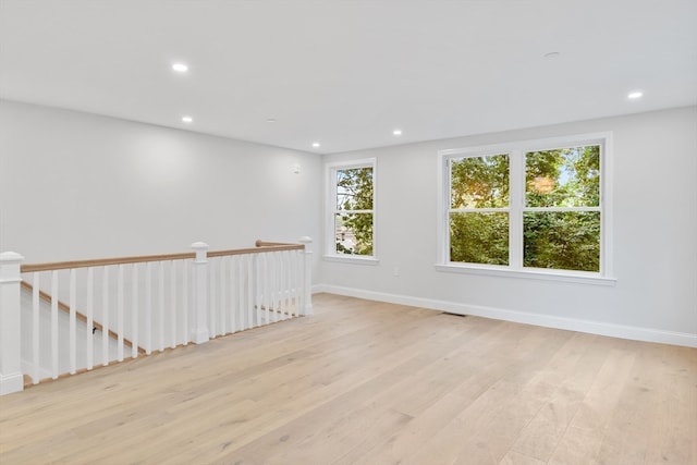 empty room with light hardwood / wood-style floors