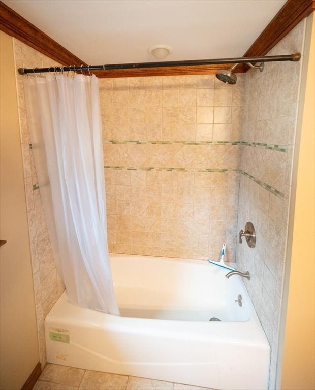 bathroom featuring tile patterned flooring and shower / bath combination with curtain