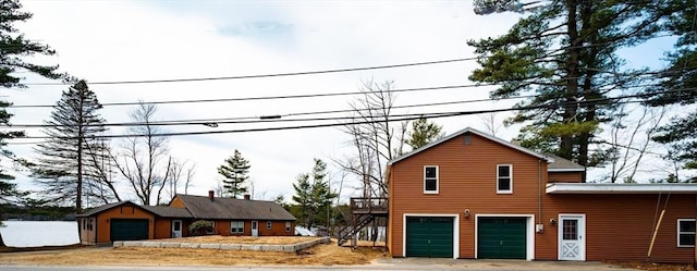 view of home's exterior with an attached garage and driveway