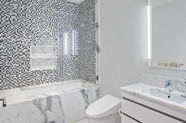 bathroom featuring toilet and oversized vanity