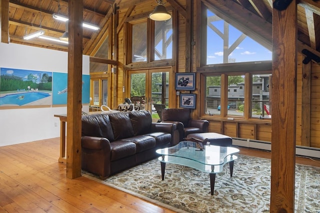 living room with wood ceiling, light hardwood / wood-style floors, french doors, high vaulted ceiling, and beam ceiling