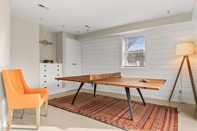 interior space featuring wood walls