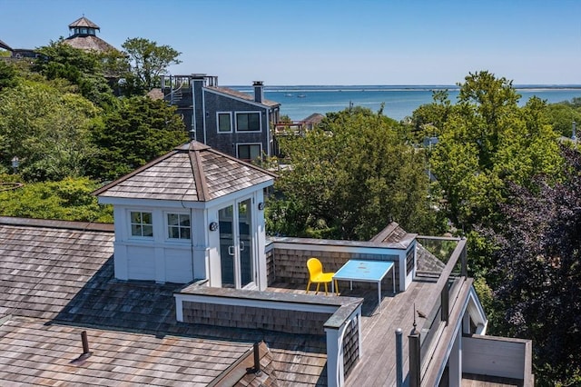 exterior space with a deck with water view