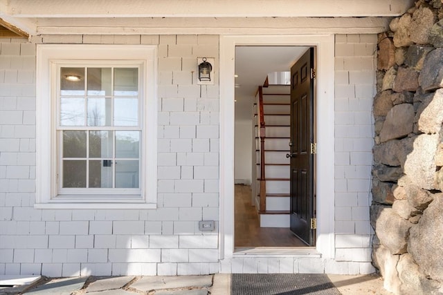 property entrance with concrete block siding