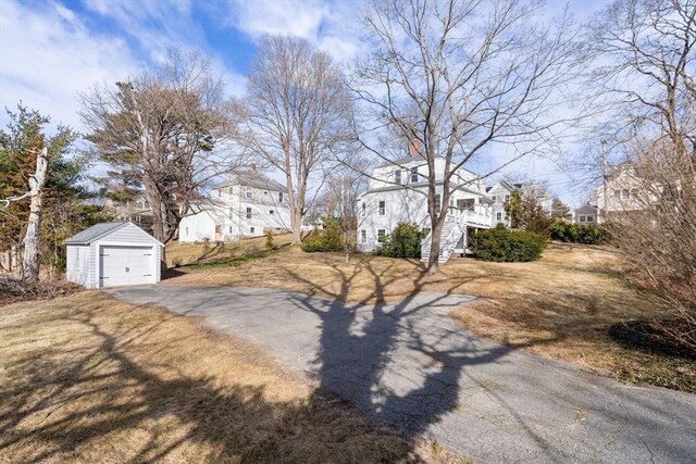 view of road featuring aphalt driveway, stairway, and a residential view