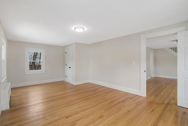 spare room with light wood-type flooring