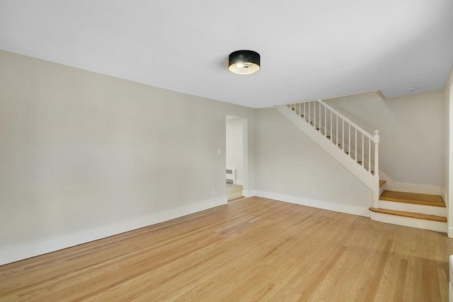 unfurnished living room with hardwood / wood-style flooring