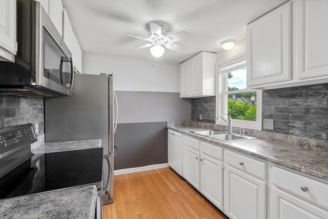 42 Sycamore Dr Unit 42, Leominster, MA 01453 - kitchen featuring appliances with stainless steel finishes, a ceiling fan, and white cabinets