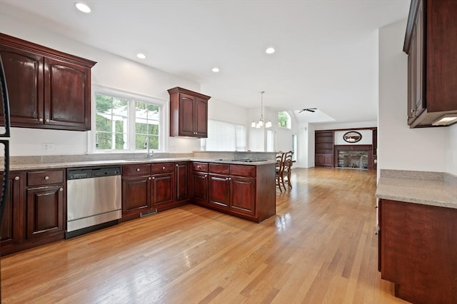 136 Howard St, Northborough, MA 01532 - kitchen with dishwasher, a peninsula, a fireplace, a sink, and light wood-style floors