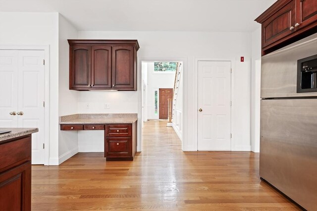 136 Howard St, Northborough, MA 01532 - kitchen featuring stainless steel refrigerator with ice dispenser, light wood-style floors, and baseboards