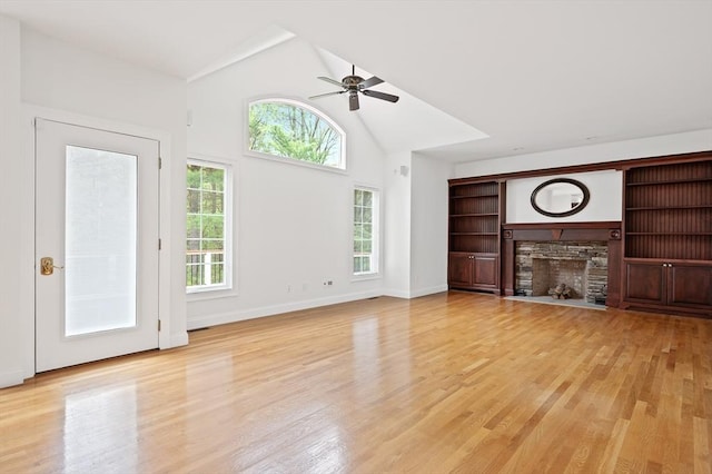 136 Howard St, Northborough, MA 01532 - unfurnished living room featuring a fireplace, light wood-style floors, ceiling fan, baseboards, and high vaulted ceiling