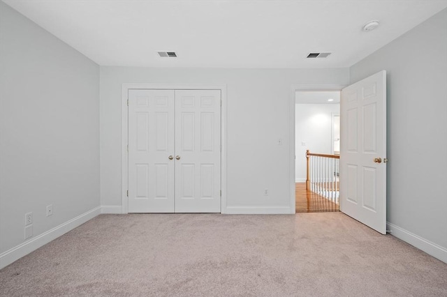 136 Howard St, Northborough, MA 01532 - unfurnished bedroom featuring carpet flooring, baseboards, and a closet