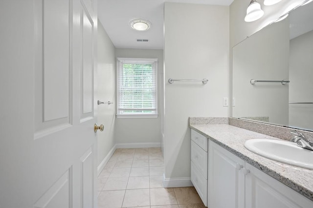 136 Howard St, Northborough, MA 01532 - bathroom featuring vanity, baseboards, and tile patterned floors