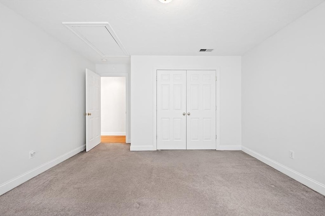 136 Howard St, Northborough, MA 01532 - unfurnished bedroom featuring attic access, carpet flooring, and baseboards