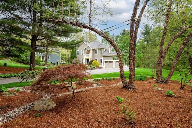 136 Howard St, Northborough, MA 01532 - view of front facade with a garage and driveway