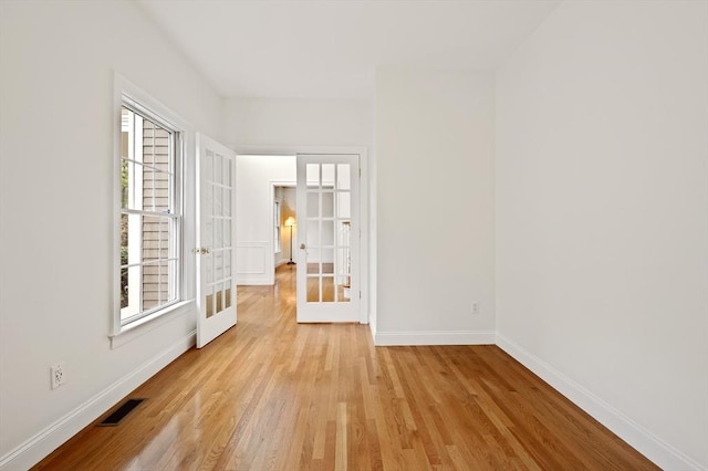 136 Howard St, Northborough, MA 01532 - spare room featuring light wood finished floors, baseboards, and french doors
