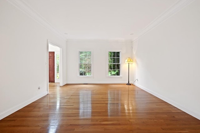 136 Howard St, Northborough, MA 01532 - unfurnished room with crown molding, wood finished floors, and baseboards
