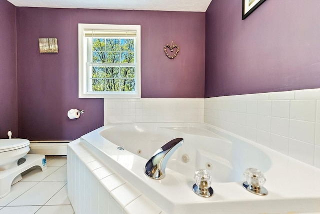 bathroom with tile patterned floors, a baseboard radiator, a whirlpool tub, and toilet