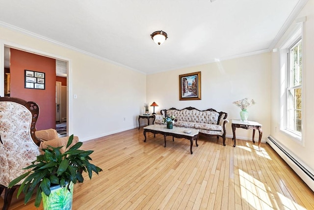 sitting room featuring crown molding, a baseboard radiator, baseboards, and hardwood / wood-style flooring