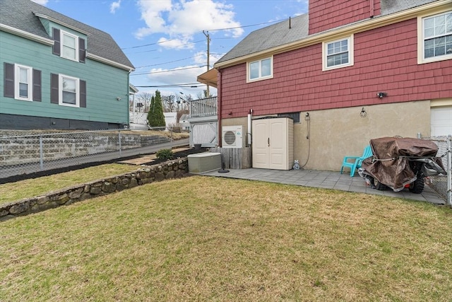 215 Lynnfield St, Lynn, MA 01904 - rear view of property featuring ac unit, cooling unit, a lawn, a patio area, and fence