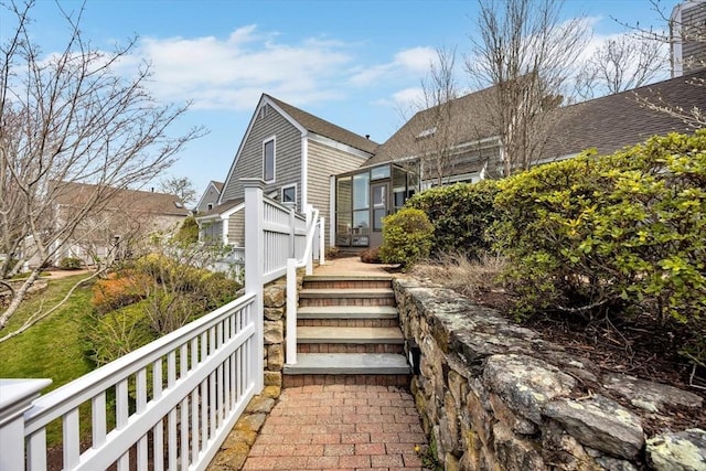 10 Lanyard Way Unit 7239, Mashpee, MA 02649 - view of property exterior featuring roof with shingles