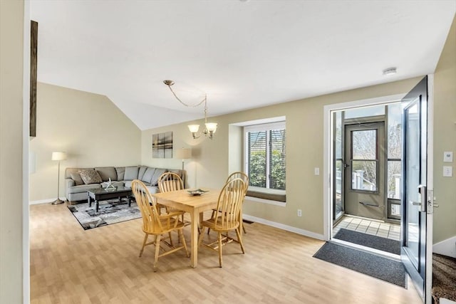 10 Lanyard Way Unit 7239, Mashpee, MA 02649 - dining room featuring light wood-type flooring, baseboards, a chandelier, and lofted ceiling