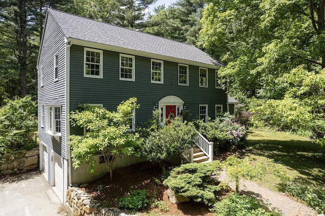 92 Clinton St, Hopkinton, MA 01748 - colonial inspired home with roof with shingles, concrete driveway, and a garage