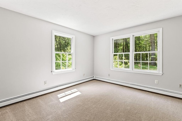 92 Clinton St, Hopkinton, MA 01748 - empty room with carpet floors and a baseboard heating unit
