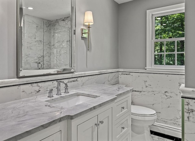 92 Clinton St, Hopkinton, MA 01748 - full bathroom with a marble finish shower, vanity, tile walls, wainscoting, and marble finish floors