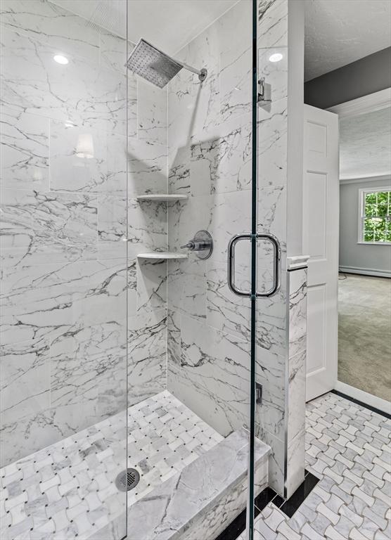 92 Clinton St, Hopkinton, MA 01748 - bathroom featuring a marble finish shower and baseboards