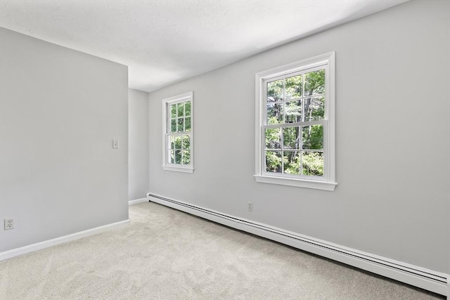 92 Clinton St, Hopkinton, MA 01748 - spare room featuring a baseboard heating unit and carpet flooring