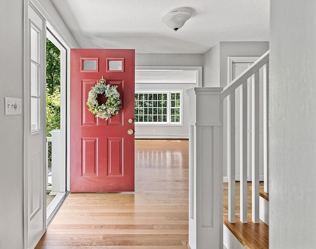 92 Clinton St, Hopkinton, MA 01748 - foyer featuring wood finished floors