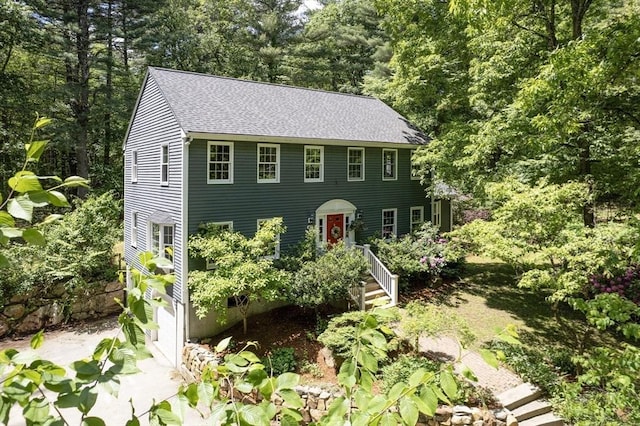 92 Clinton St, Hopkinton, MA 01748 - colonial house featuring roof with shingles